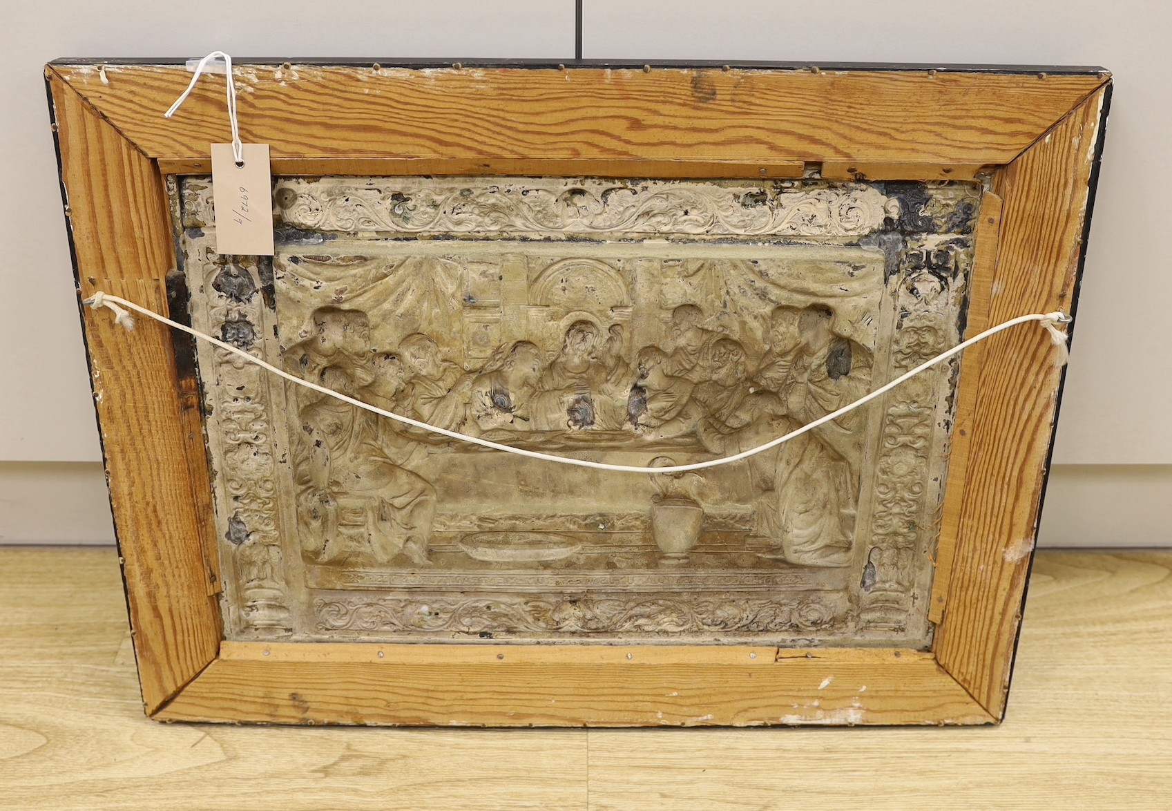 A framed embossed plaque, The Last Supper, silver plate on copper, 34.5 x 50cm excl frame